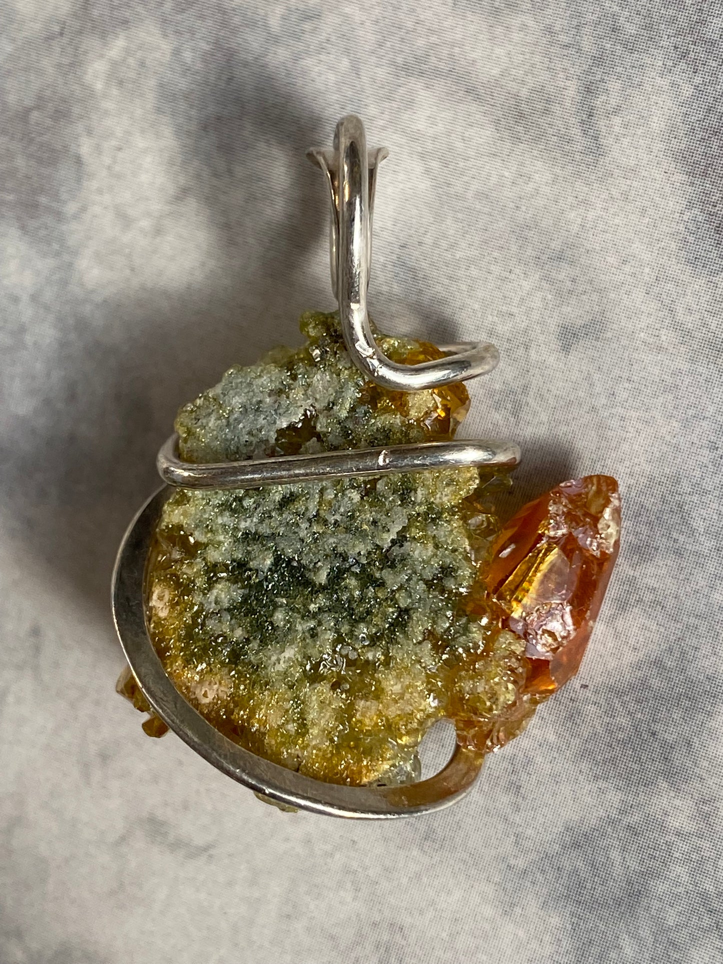 Polish Orange and Green Zincite in Sterling Silver Tension Wrapped Pendant