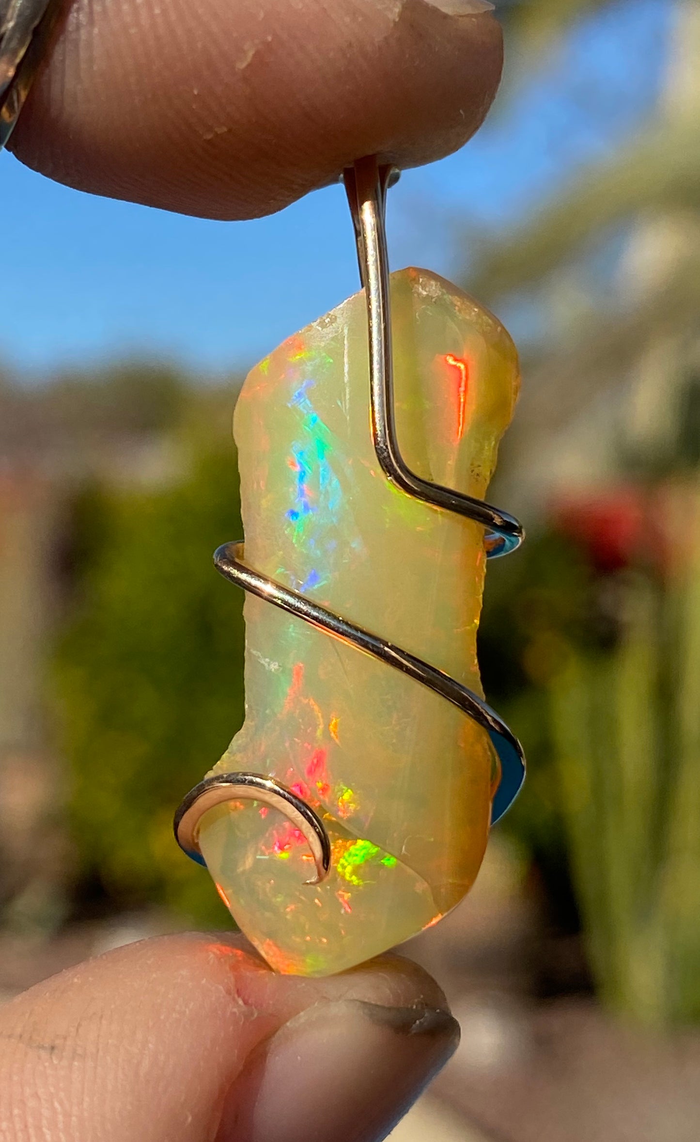 Ethiopian Opal in 14kt Gold Tension Wrapped Pendant