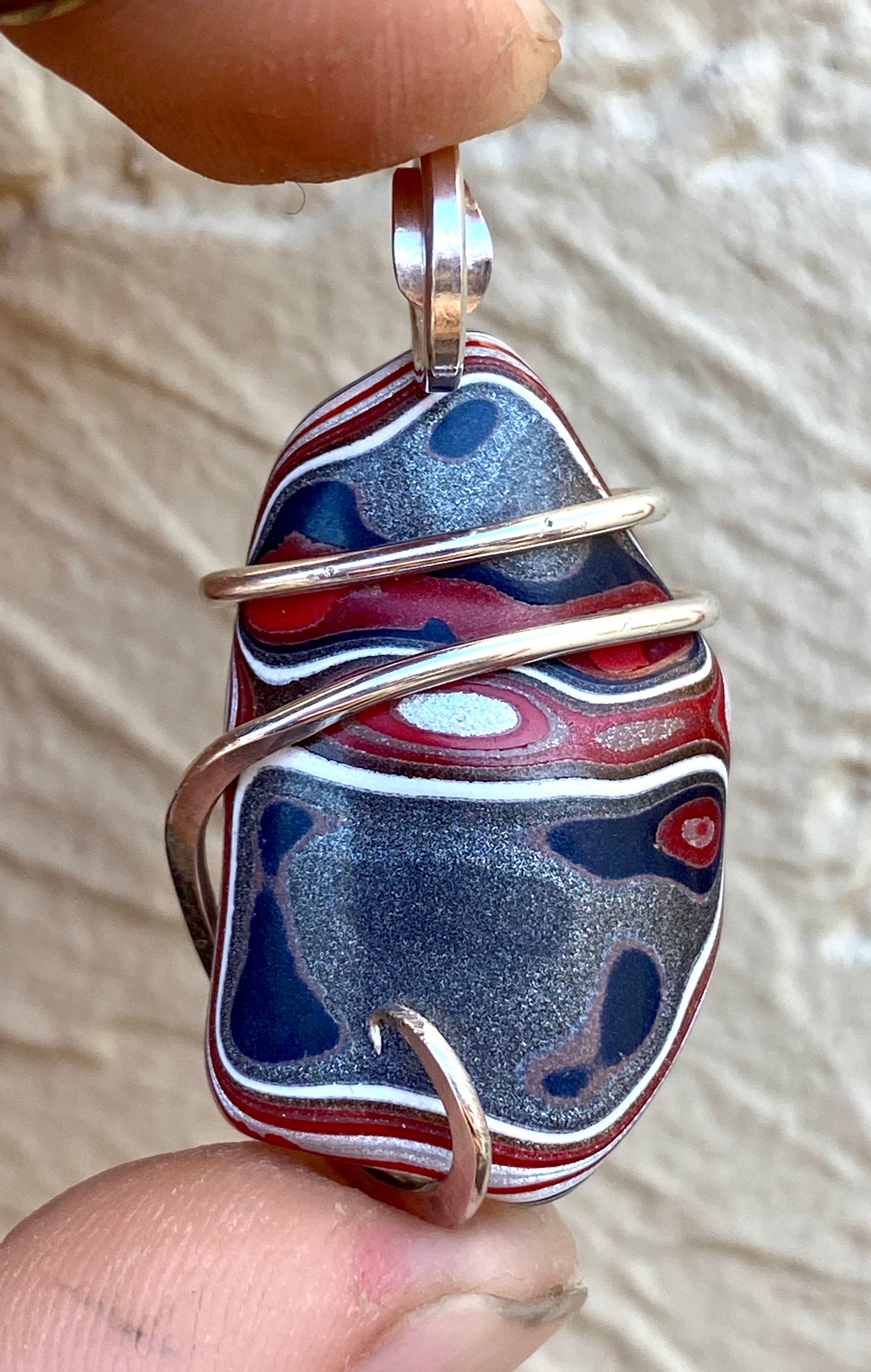 Fordite in Sterling Silver Tension Wrapped Pendant