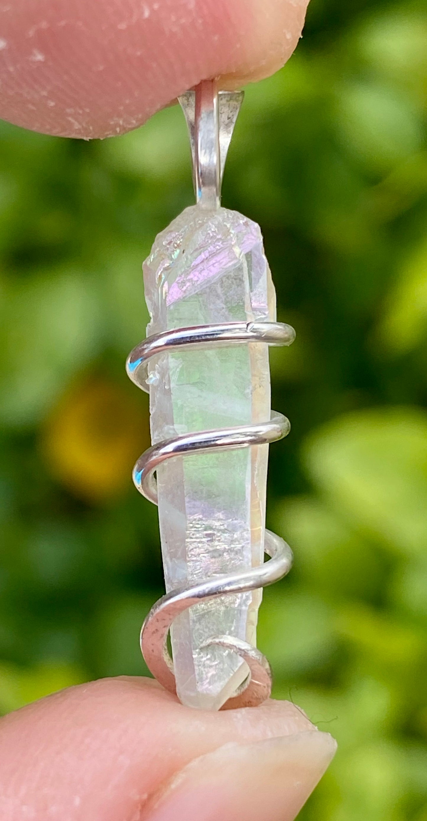 Platinum Infused Quartz Crystal in Sterling Silver Tension Wrapped Pendant
