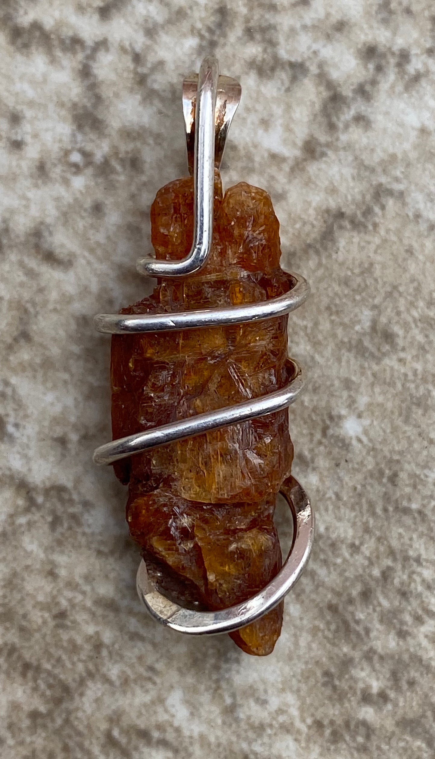 Red Kyanite Crystal in Sterling Silver Tension Wrapped Pendant