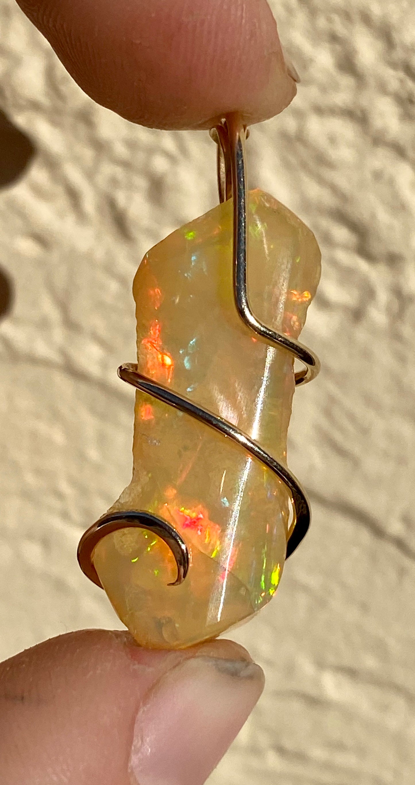 Ethiopian Opal in 14kt Gold Tension Wrapped Pendant