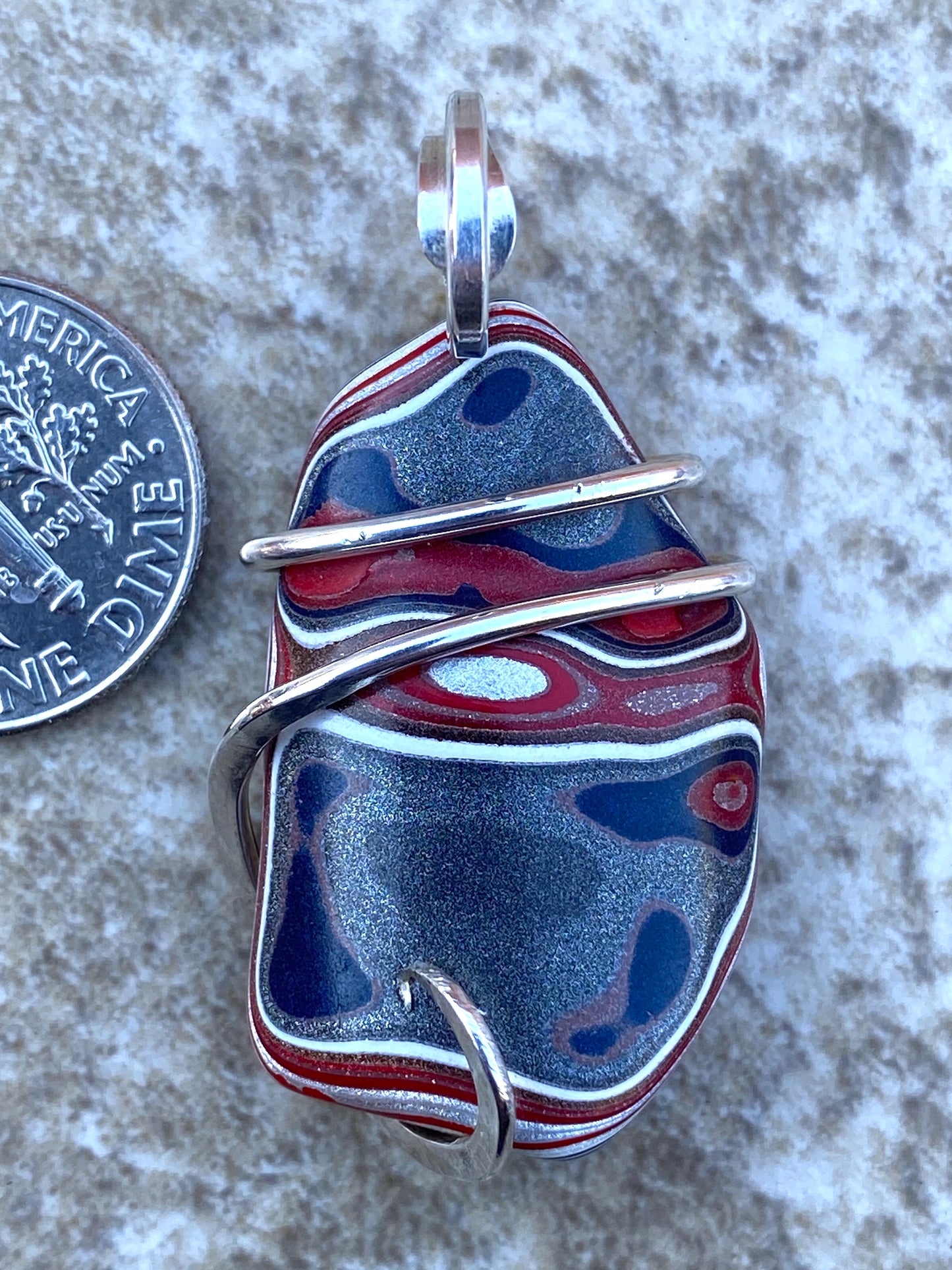 Fordite in Sterling Silver Tension Wrapped Pendant