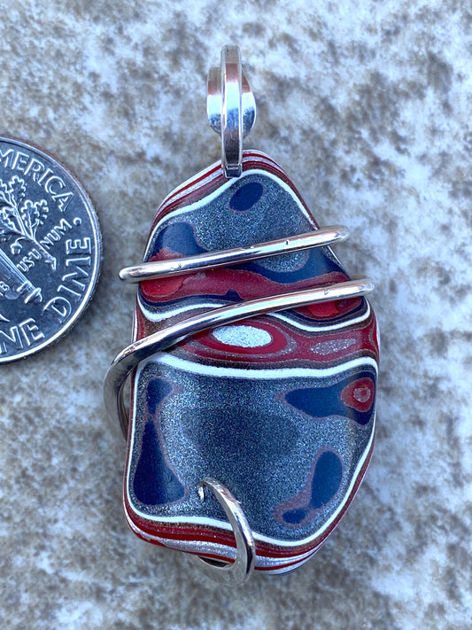Fordite in Sterling Silver Tension Wrapped Pendant
