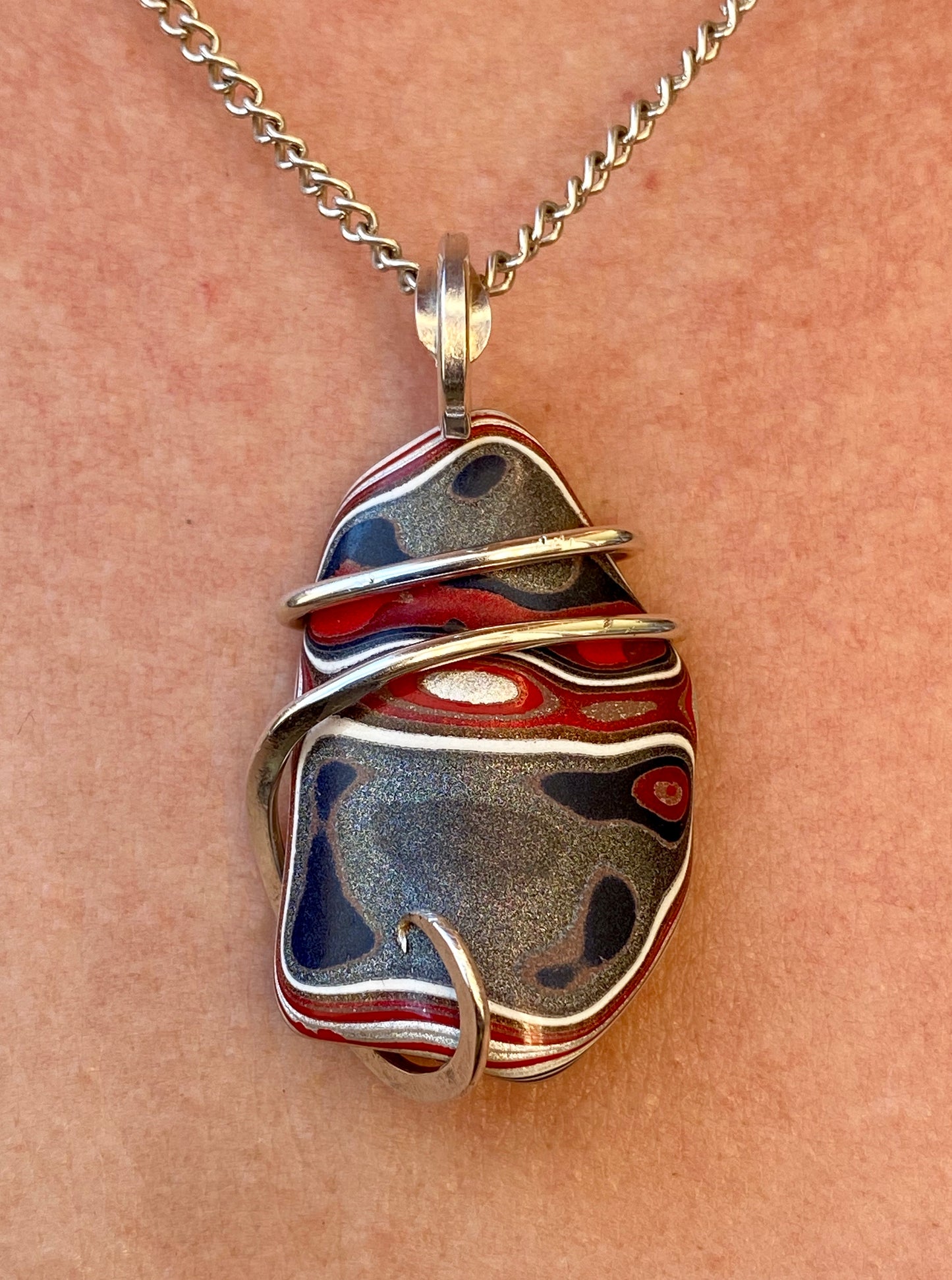 Fordite in Sterling Silver Tension Wrapped Pendant