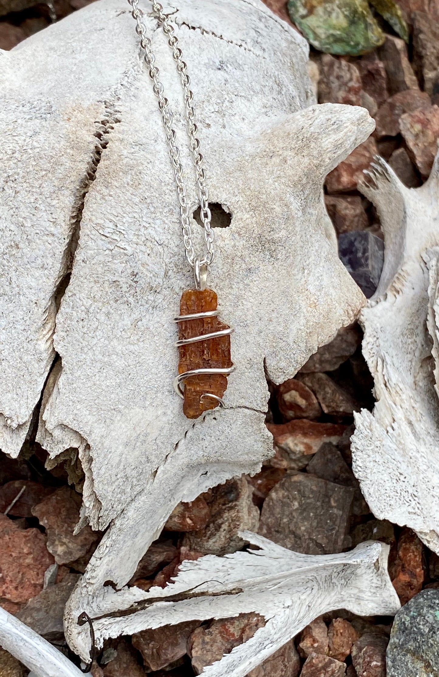 Red Kyanite Crystal in Sterling Silver Tension Wrapped Pendant