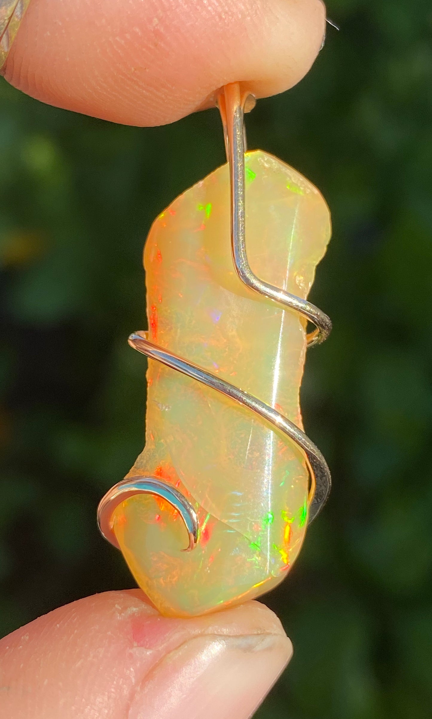Ethiopian Opal in 14kt Gold Tension Wrapped Pendant