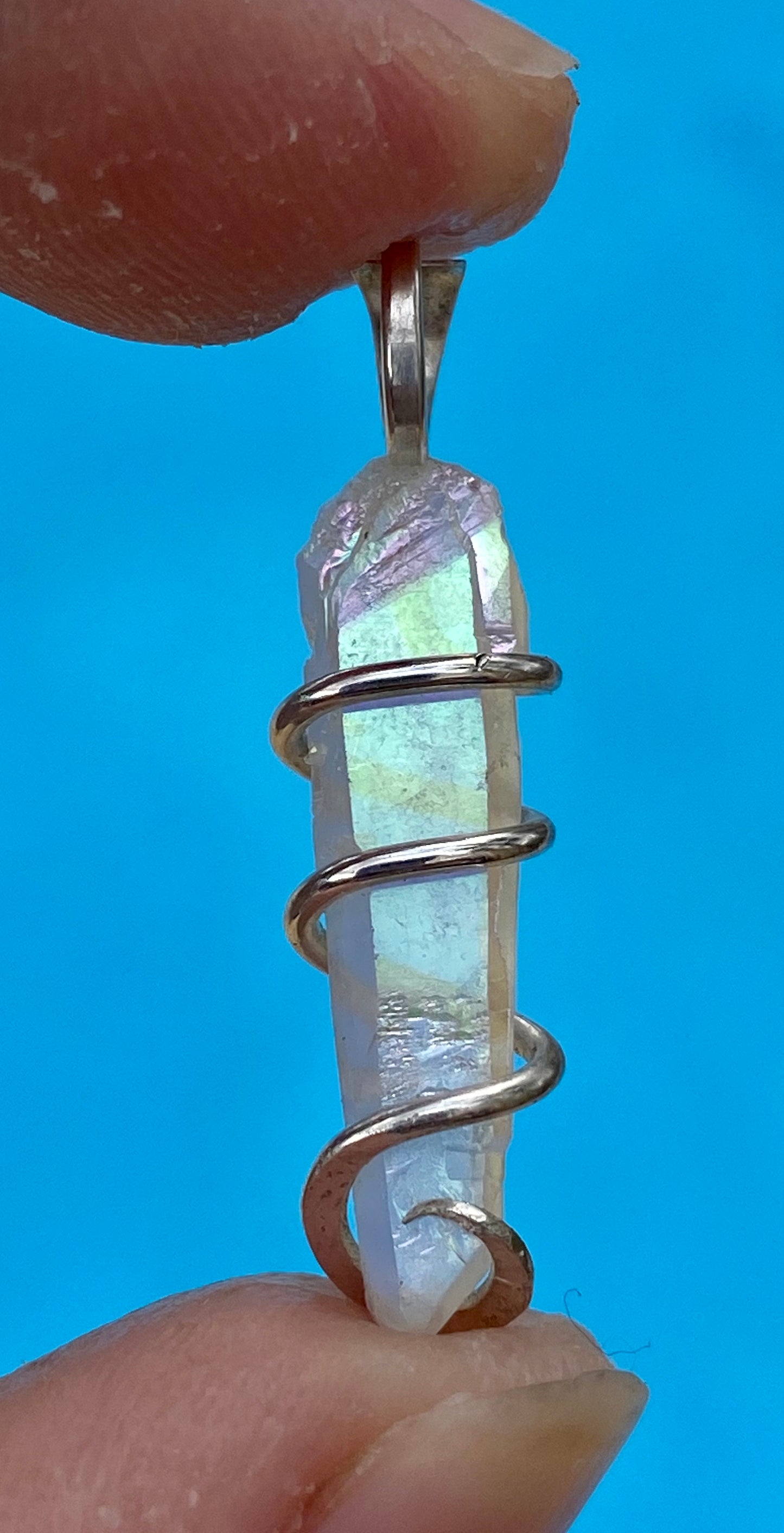 Platinum Infused Quartz Crystal in Sterling Silver Tension Wrapped Pendant