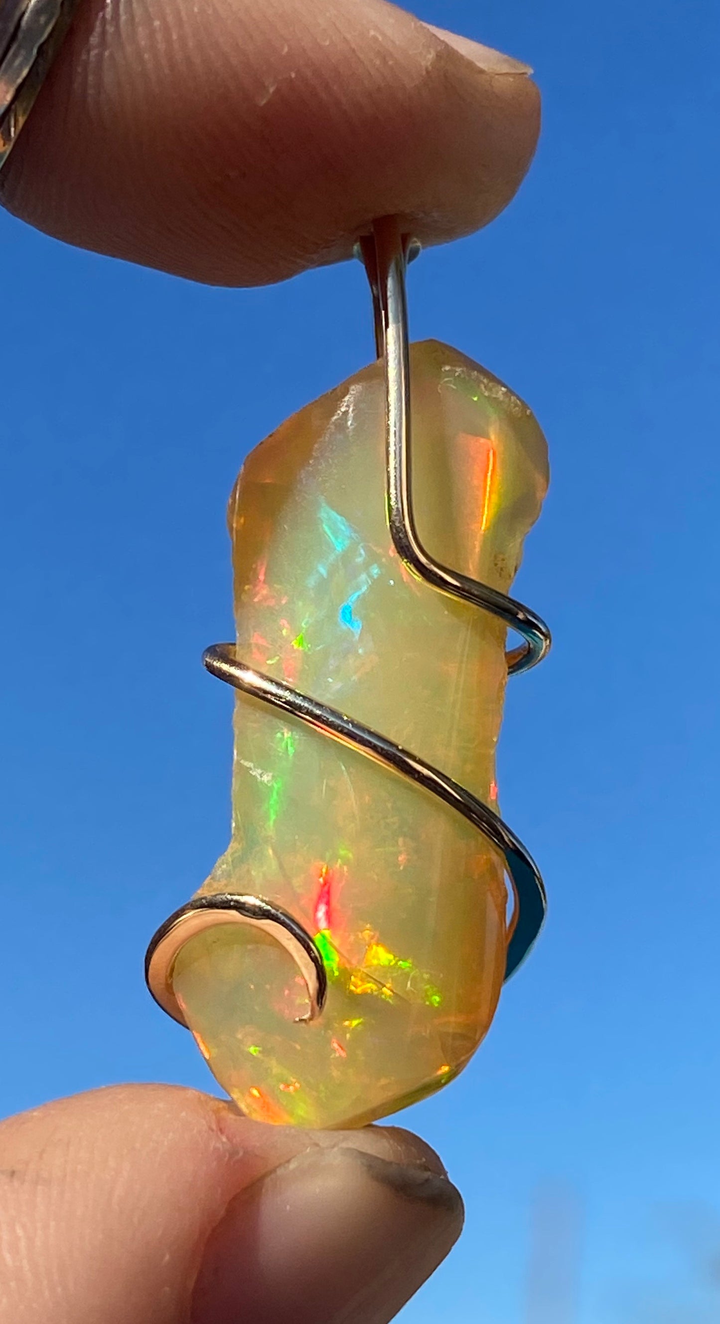 Ethiopian Opal in 14kt Gold Tension Wrapped Pendant