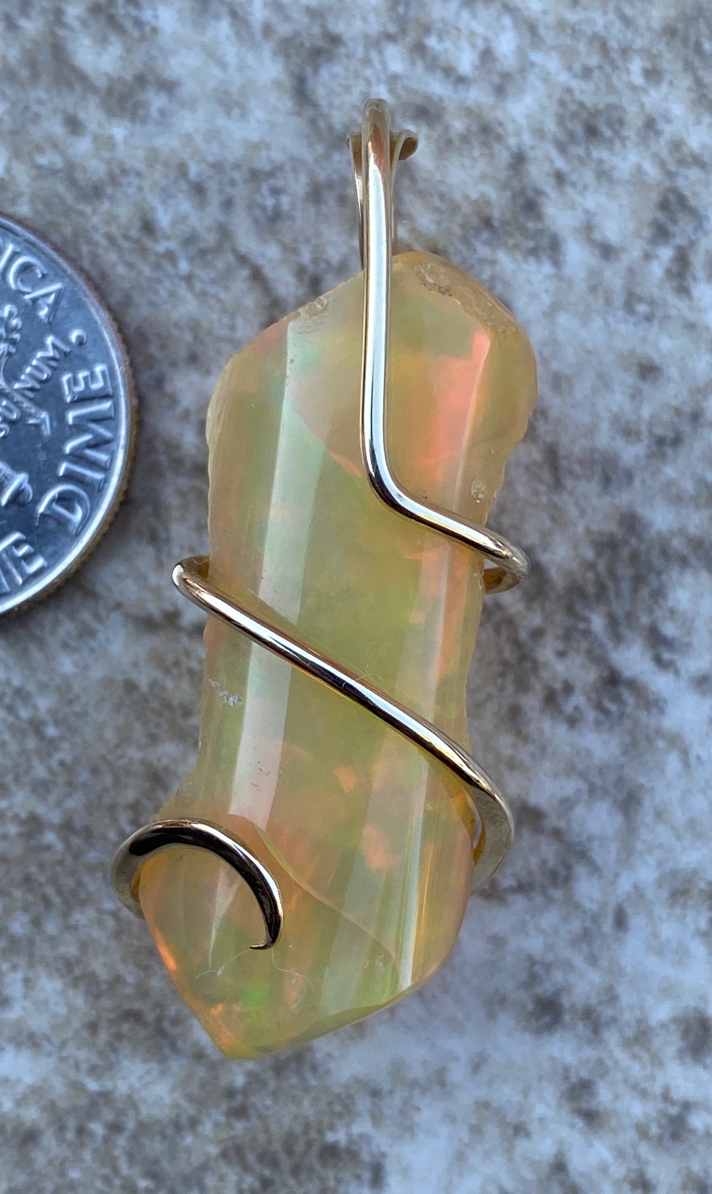 Ethiopian Opal in 14kt Gold Tension Wrapped Pendant