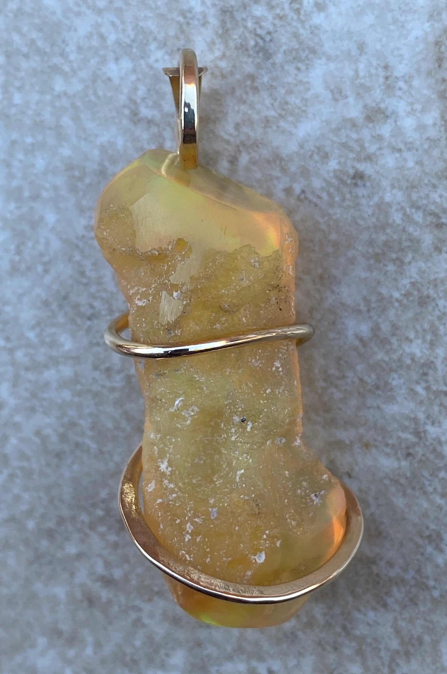 Ethiopian Opal in 14kt Gold Tension Wrapped Pendant