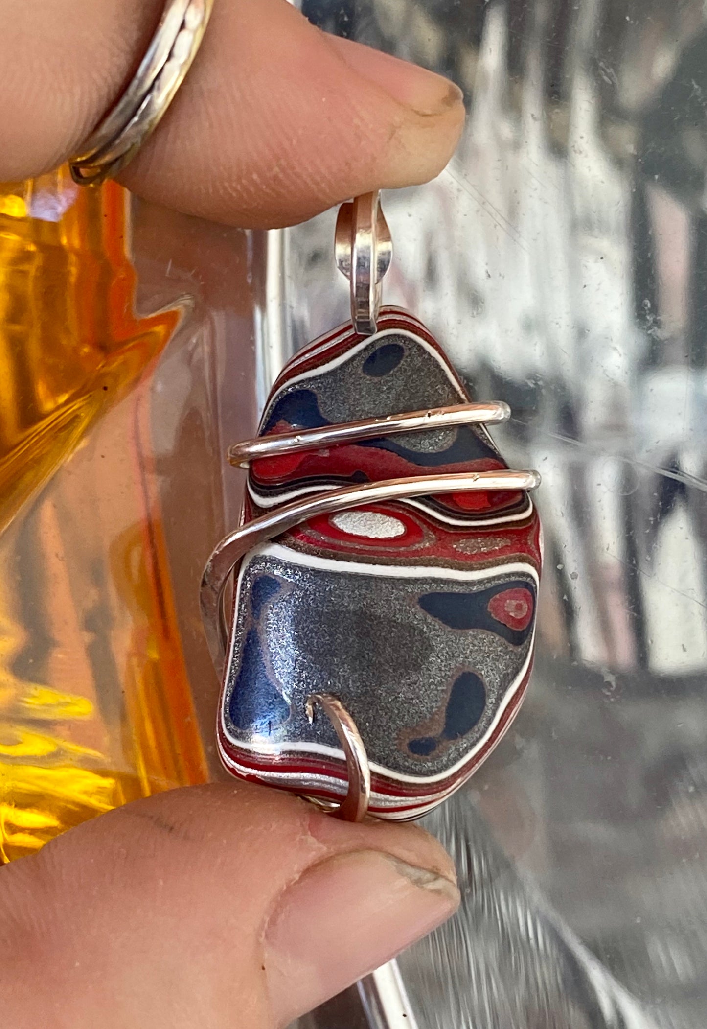 Fordite in Sterling Silver Tension Wrapped Pendant