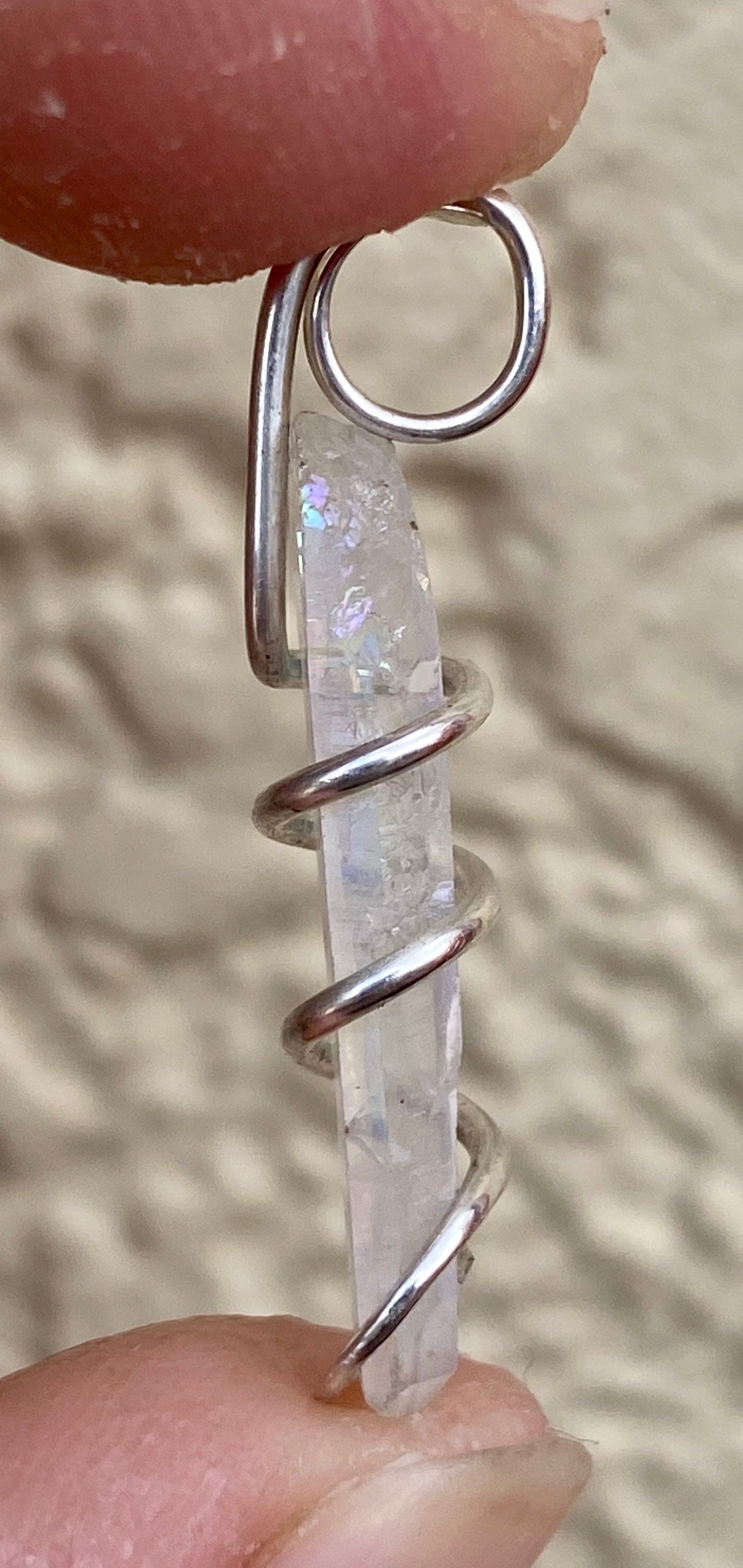 Platinum Infused Quartz Crystal in Sterling Silver Tension Wrapped Pendant