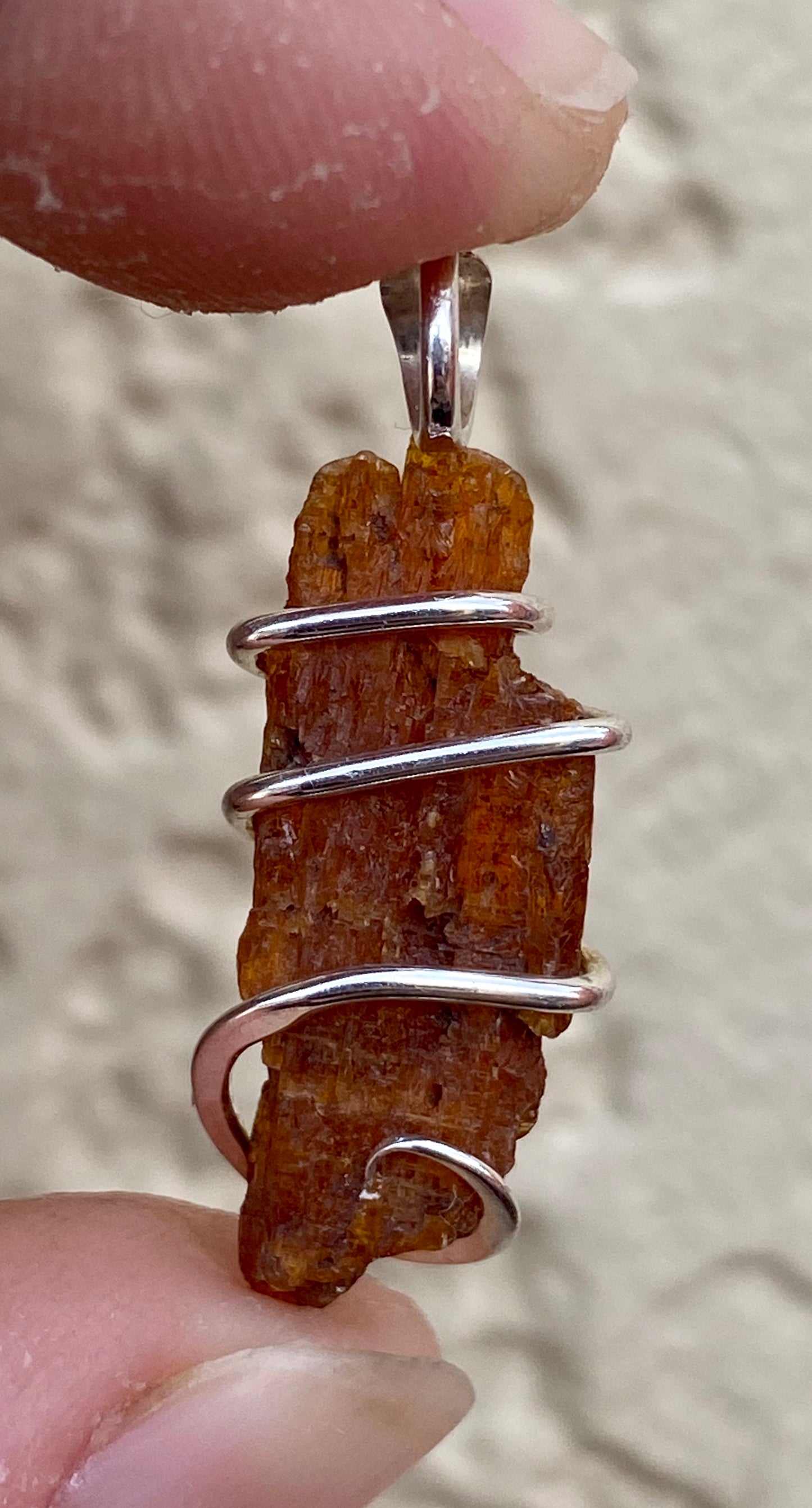 Red Kyanite Crystal in Sterling Silver Tension Wrapped Pendant