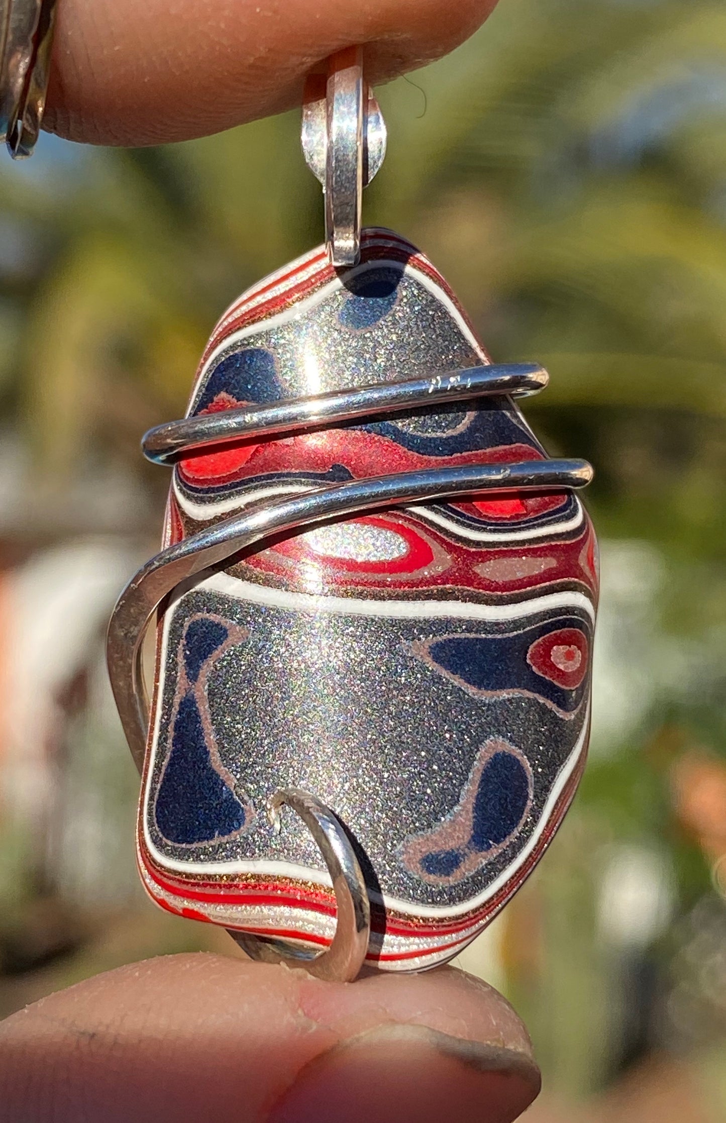 Fordite in Sterling Silver Tension Wrapped Pendant