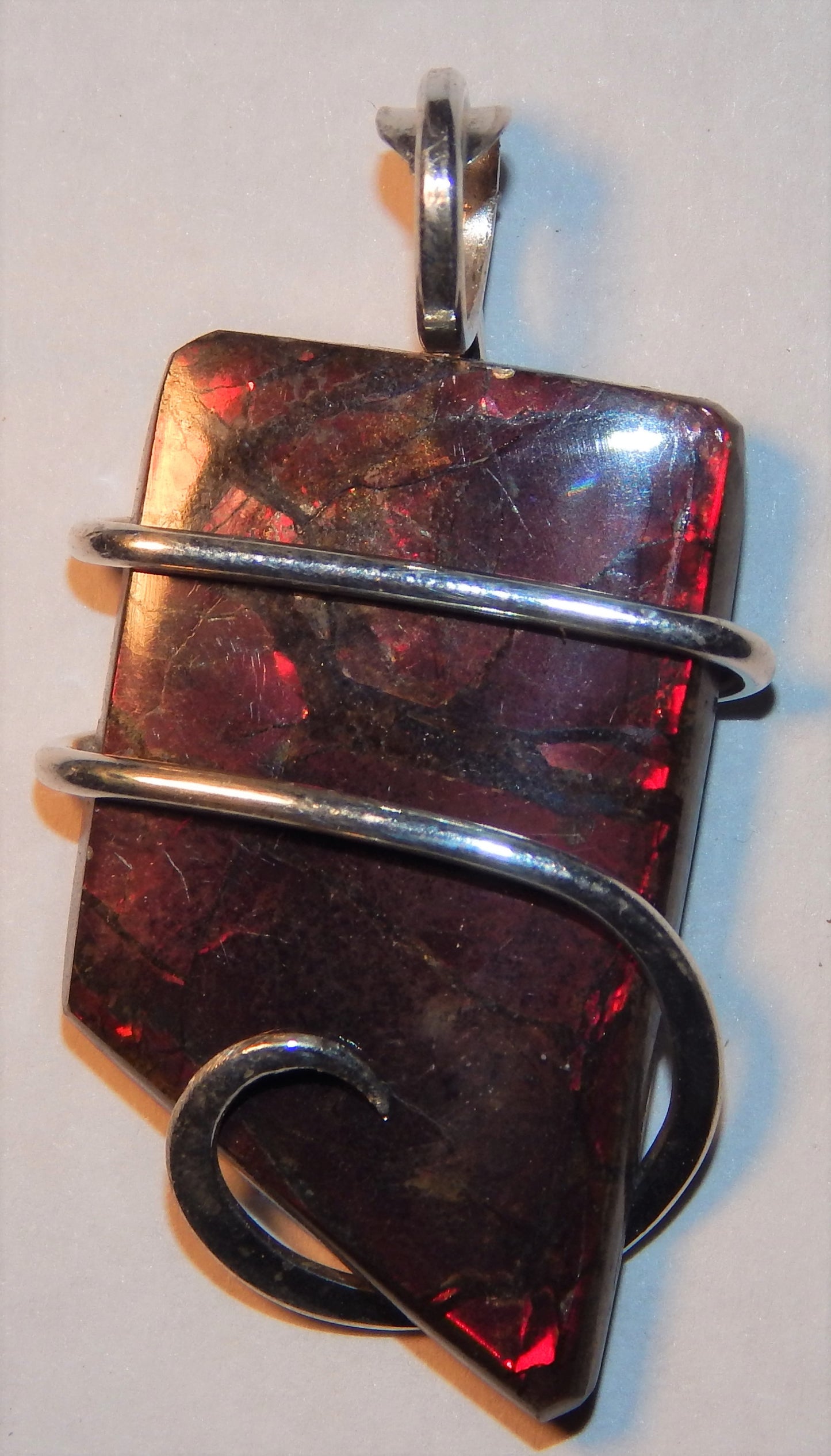 Ammolite Shell Slice in Sterling Silver Tension Wrapped Pendant