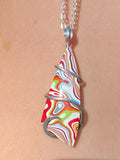 Fordite Cabochon in Sterling Silver Tension Wrapped Pendant