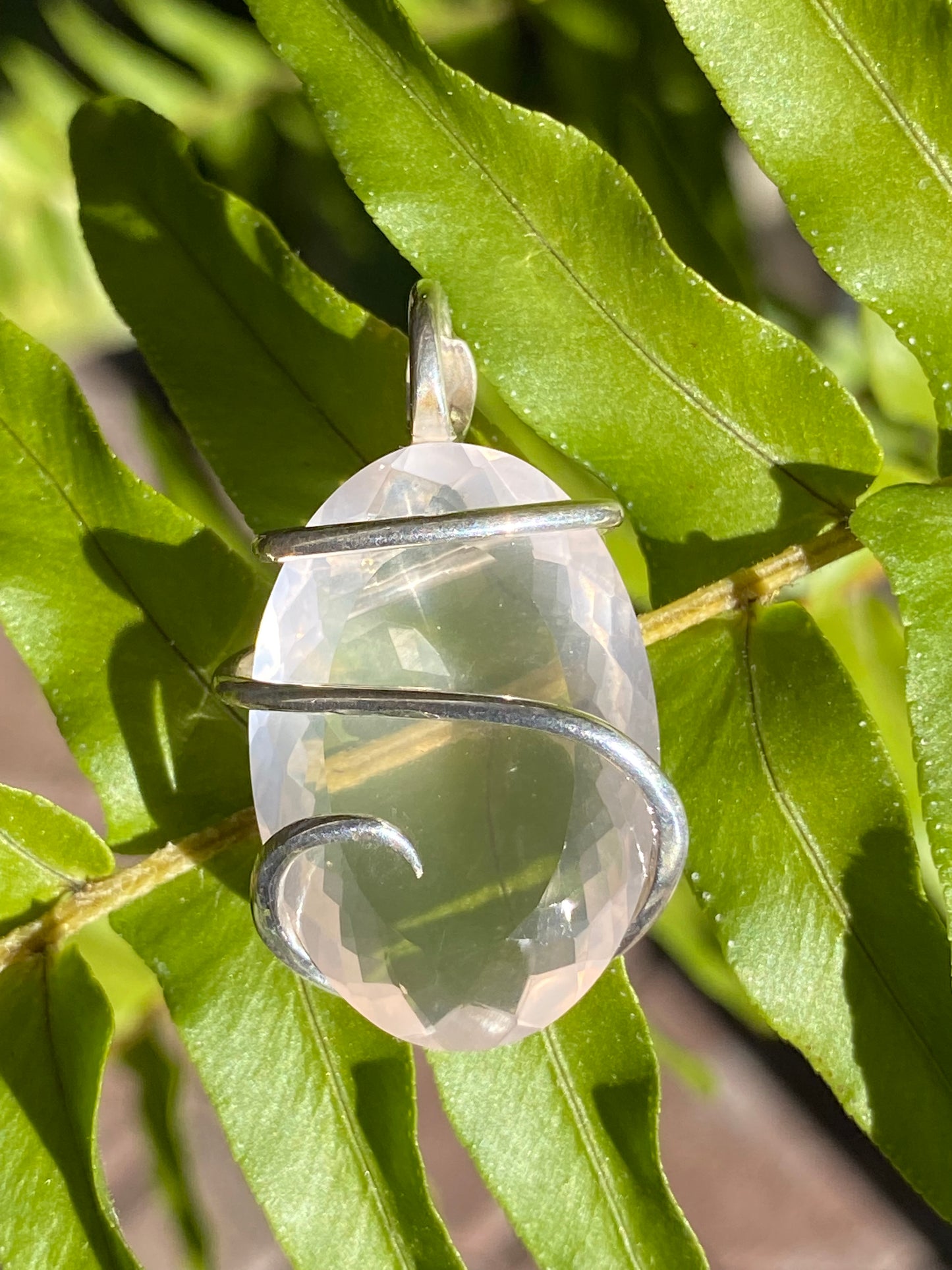 Faceted Rose Quartz in Sterling Silver Tension Wrapped Pendant