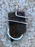 Ammolite Shell Slice in Sterling Silver Tension Wrapped Pendant