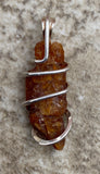 Red Kyanite Crystal in Sterling Silver Tension Wrapped Pendant