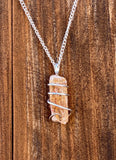 Imperial Topaz Crystal in Sterling Silver Tension Wrapped Pendant