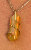 Ethiopian Opal in 14kt Gold Tension Wrapped Pendant