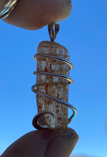 Imperial Topaz Crystal in Sterling Silver Tension Wrapped Pendant