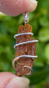 Red Kyanite Crystal in Sterling Silver Tension Wrapped Pendant
